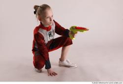 DENISA SITTING POSE WITH GUN